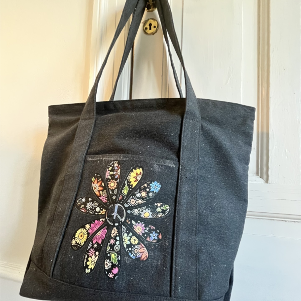 Blomst med peacelogo